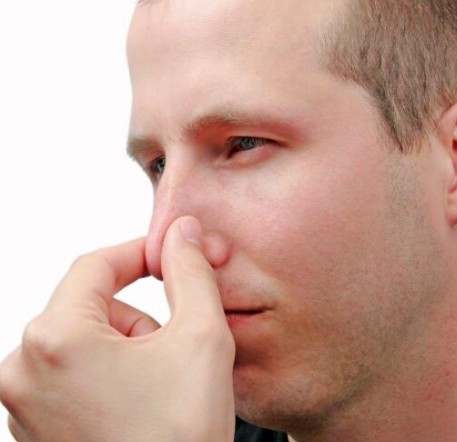 Man trying to pop his ears.